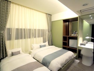 澎湖沐光之居簡約3人房：4-s(三人房)1大床-1小床。備註：本張照片由業者提供。